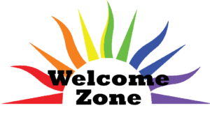 Logo of the WelcomeZone program; sun rays displayed in rainbow coloring with the wording "WelcomeZone" in the center. 