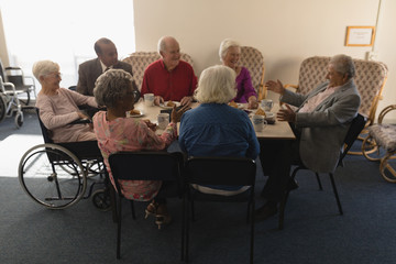 group of elderly sitting around in a circle.
